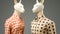 Two mannequins of animals dressed in shirts with dots