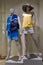 Two mannequins, male and female, dressed in summer clothes