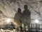 Two mans shadows on a wall in Ialominta cave