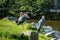 Two Marabou storks by the water in the ZOO