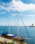 Two-masted wooden sailboat moored in harbor