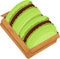 Two matcha macaroons with chocolate cream in a box, top view, matcha macaroons