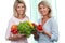 Two mature girlfriends with fresh vegetables
