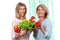 Two mature girlfriends with fresh vegetables