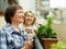 Two mature housewives enjoying tea at terrace