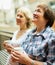 Two mature women drinking tea