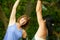 Two mature women keeping fit and streching before jogging