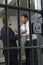 Two Men Arguing In Prison Cell