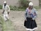 Two men dressed as husband and wife, an ancient ritual performed on local weddings in the highland Amaru community.