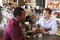 Two Men Enjoying Lunch In Delicatessen Restaurant