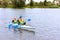 Two men on a kayak, tourists rafters in a blue boat, Matrosovka river