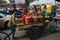Two men pushing a fuel loaded cart in New Delhi