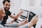 Two Men Repairing Hardware Equipment from Laptop.