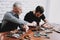 Two Men Repairing Hardware Equipment from PC.