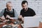 Two Men Repairing Hardware Equipment from PC.