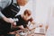 Two Men Repairing Hardware Equipment in Workshop.