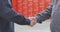 Two men shake hands. Handshake of two men close-up. Factory shaking hands, concluding a successful deal