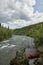 Two men shelter from rapids on wild Alaskan river