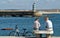 Two men sitting on the Atlantic coast, Centro - Portugal