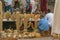 Two men sitting in a decorative straw cactus stand in Marrakech. Morocco, in October 2019