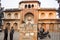 Two men standing and talking outside of safdarjung tomb memorial at winter morning