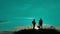 Two men tourists night hikers silhouette go to the mountains sunset travel slow motion video. Traveler successful young