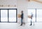 Two men walking with cardboard boxes when furnishing new house. Motion blur.