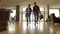 Two men walking in lobby hotel on background revolving door low angle view