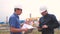 Two men working engineers work at a gas plant producing gas oil. industry business teamwork concept. Worker and engineer