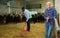 Two men working in goat barn