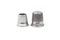 Two metal silver sewing thimbles on a white background. Sewing accessories and tools.