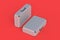 Two metal suitcases for money or documents on red background