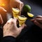 Two Mexican men at bar drinking a golden tequila shot with lime