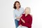 Two middle aged women talking. Isolated white background. Women support women concept. Happy menopause healthy lifestyle. Copy