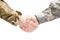 Two military men shaking hands on white background - close up studio shot