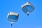 Two military paratroopers parachutes in the sky