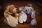 Two miniature home made teddy bears sewing the pattern pieces of another teddy bear