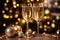 Two misted glasses of champagne on the background of a festive New Year\\\'s bokeh.