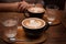 Two Mocha coffees with water served at a cafe