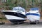 Two modern boats yachts stored up in dry boat storage waiting for maintenance