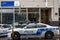 Two Montreal Police Service SPVM cars standing in front of a local police station. The SPVM is the police of Montreal, Quebec