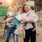 Two mothers with babies in baby carriers warp