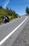 Two motorcyclists coming down a mountain road