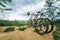 Two mountain bikes stands on trail