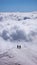 Two mountain climbers on an exposed ridge in the Swiss Alps