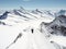 Two mountain climbers on a narrow ridge in the Swiss Alps with a spectacular view of the Aletsch Region