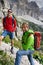 Two mountain guides smiling and having a look at the climbing route before them