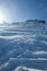 Two mountaineers on the way to the summit on snowy ground, a sunny winter morning