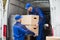 Two Movers Carrying Cardboard Box