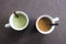 Two mugs next to each other with matcha tea and oat milk latte